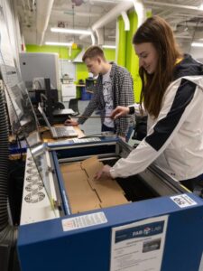 Photo of students using the equipment in the Discovery Center Fab Lab. / UW-Stout