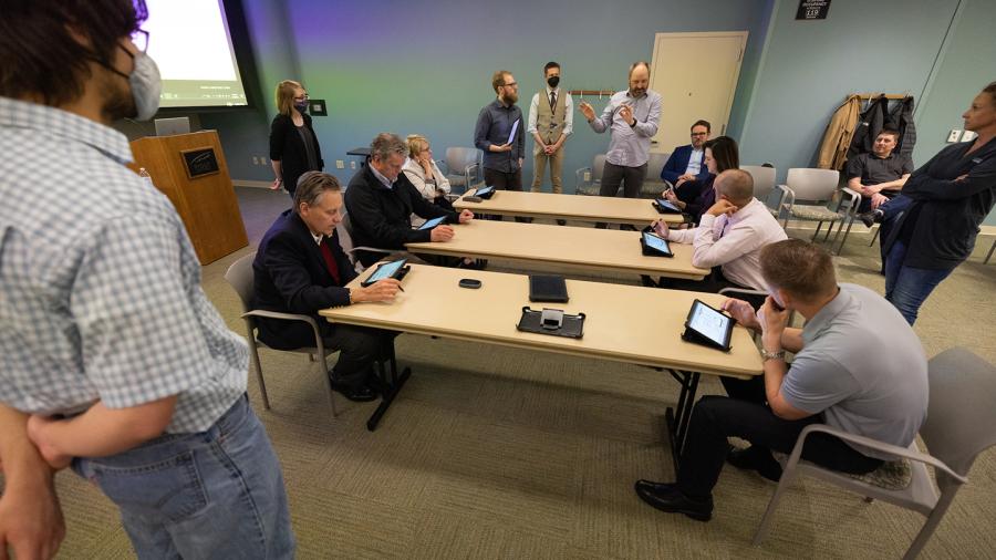 Photo of officials from UW-Stout, business and industry, who tested Buzz Digital recently at UW-Stout. The simulation, on tablets, is new nationally to Lean training. / UW-Stout