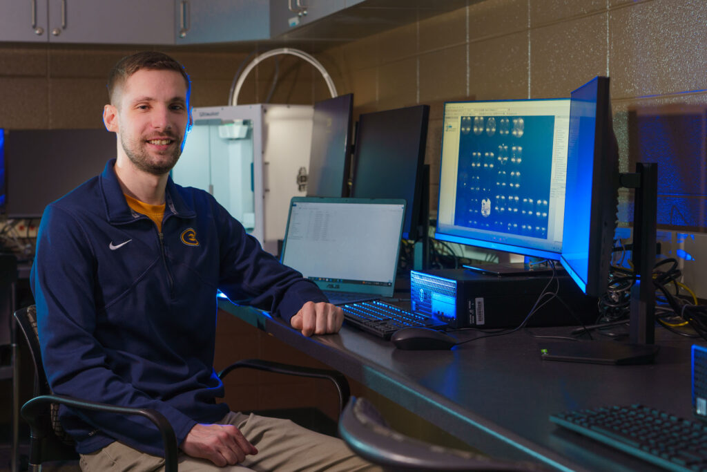 Photo of Jordan Langlois, a senior computer science major, who is part of a UW-Eau Claire undergraduate research team that studied how machine learning was used to solve problems related to COVID-19. The Blugolds’ research was published in a professional journal this summer. (Photo by Bill Hoepner)