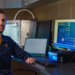 Photo of Jordan Langlois, a senior computer science major, who is part of a UW-Eau Claire undergraduate research team that studied how machine learning was used to solve problems related to COVID-19. The Blugolds’ research was published in a professional journal this summer. (Photo by Bill Hoepner)