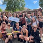 Photo of the 2022 CETS cohort, which was led through the Prague leg of their journey by Blugold grad and Fulbright scholar Megan Henning (holding sign), and her familiarity with the city proved to be a tremendous bonus. (Submitted photo)
