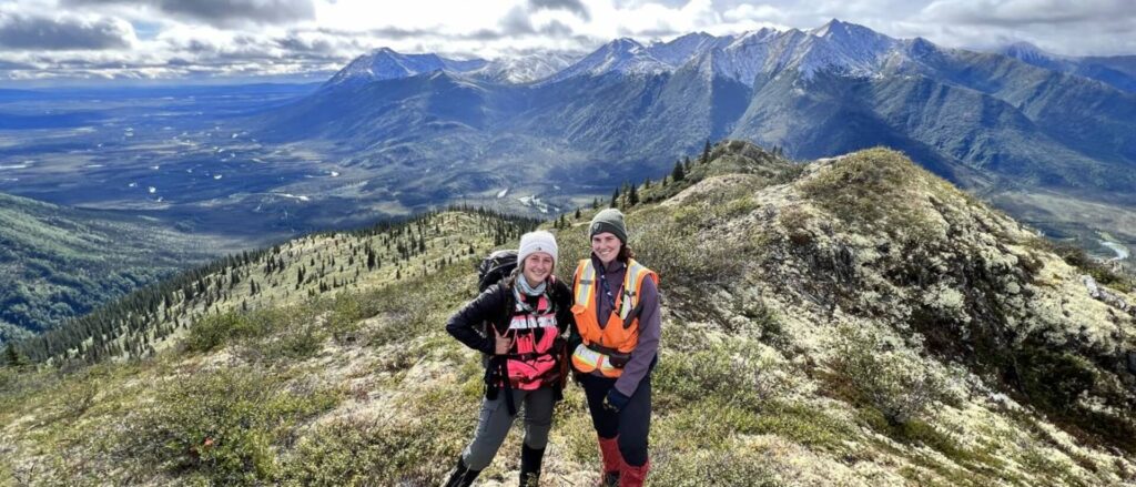 Photo of geology majors Bryanna Rayhorn (left) and Lindsey Henricks spent their summer living on a mountain range above the Arctic Circle while working for a geological consulting firm in northern Alaska. The area was so remote that they had to take a helicopter to get to work every day, something the Blugolds say added to their experience. Both say they gained skills and confidence, which will help them in their future careers. (Submitted photo)