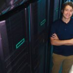 Photo: While Tyler Bauer does most of his system administrative work on campus, the actual nodes of the Blugold supercomputing cluster shown here are located in a shared technology space owned by Chippewa Valley Technical College on the northwest side of Eau Claire. (Photo by Bill Hoepner)