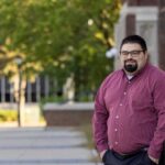 Photo of Michail Walker, business consultant and outreach specialist with the UWL Wisconsin Small Business Development Center, who has been named to the 7 Rivers Alliance’s Rising Stars Under 40 list.