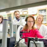 Photo of Karyn Frick (seated) and members of her lab – Miranda Schwabe (from left), Gustavo Dalto Barroso Machado, Sarah Beamish and Farah Abdelazim – who have recently published research that shows why some women with Alzheimer’s disease benefit from taking estrogen therapy, while others do not. (UWM Photo/Troye Fox)