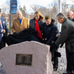 Photo of the unveiling of the Vietnam Veterans Memorial at UW-Platteville. (from left to right) Greg Tremelling, Coordinator of UW-Platteville’s Wright Center for Non-Traditional and Veteran Students; Dr. James Lawton; Interim Chancellor Tammy Evetovich; Lt. Col. Mac Kolar; Interim Provost Wayne Weber; and Professor of History Dr. David Krugler. (Photo credit: UW-Platteville)