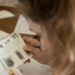 Photo of a student in UW-Platteville's Criminal Justice and Forensic Investigation programs examining evidence. (Photo credit: UW-Platteville)