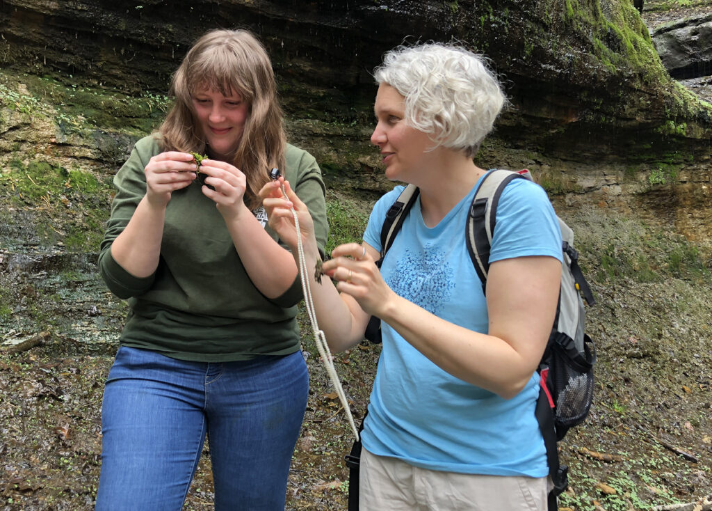 Photo of student Britney Serafina, left, and Professor Amanda Little talking about their plant research at Devil’s Punchbowl. / Madelyn Lisius photo