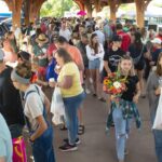 Photo of Eau Claire Farmers Market. A UW-Eau Claire research team working with the Eau Claire Downtown Farmers Market on a program that helps community members who are food insecure buy more fruits and vegetables. Dr. Eric Jamelske, professor of economics, leads the ongoing project, which has included dozens of Blugolds as researchers and/or volunteers. (Photo by Shane Opatz)