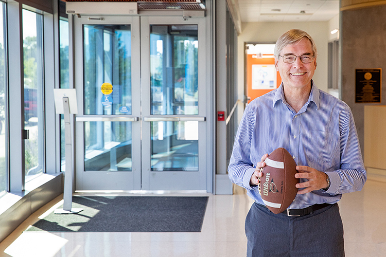 Photo of Paul Roebber, a UWM professor of mathematical sciences, who led a research team that used machine learning and 10 years of NFL play-by-play data to show that momentum in sports is a real phenomenon. (UWM Photo/Troye Fox).