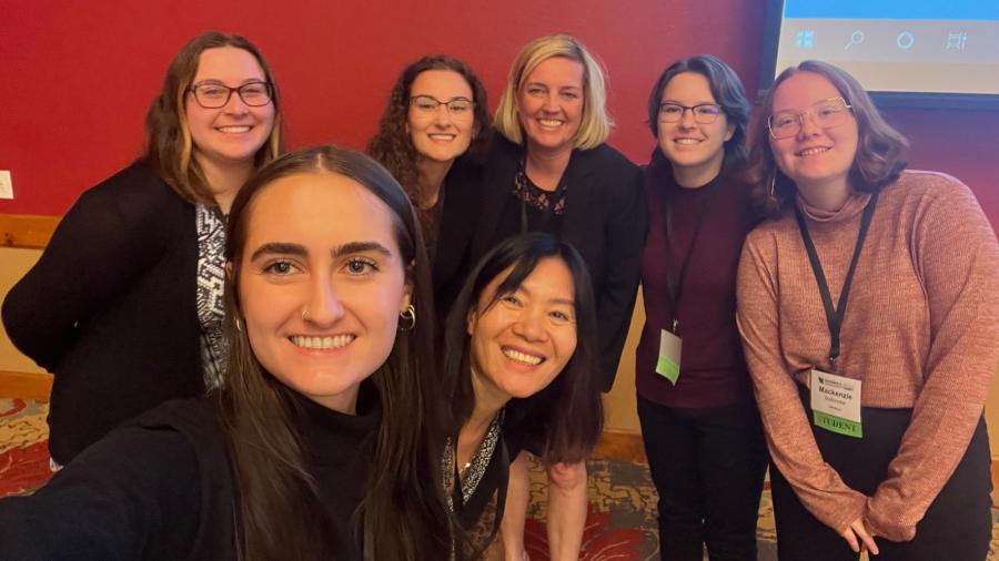 Photo of Professor Holly Yuan (front center) and a female cybersecurity student at Wisconsin's first women's cybersecurity event as part of the Governor's Cybersecurity Summit / Holly Yuan