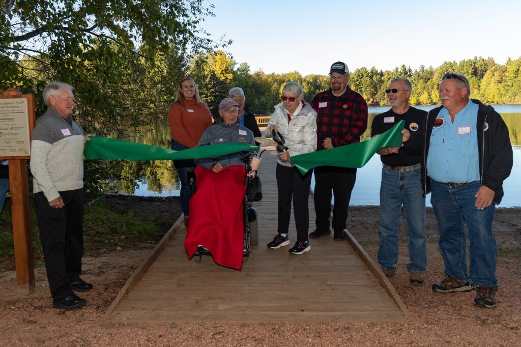 Photo of Friends of Schmeeckle, donors and community members attending a ribbon cutting for the new accessible fishing pier and Lake Loop Trail at Schmeeckle Reserve on Sept. 29.