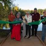 Photo of Friends of Schmeeckle, donors and community members attending a ribbon cutting for the new accessible fishing pier and Lake Loop Trail at Schmeeckle Reserve on Sept. 29.