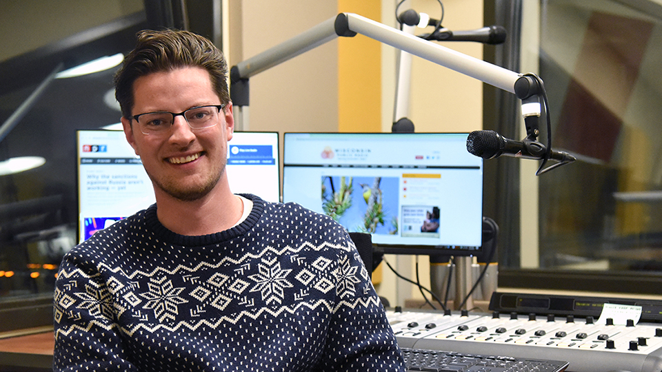 Photo of Alex Crowe, a 2015 graduate of the University of Wisconsin Oshkosh’s radio TV film (RTF) program, who recently became WPR’s host of NPR’s Morning Edition.