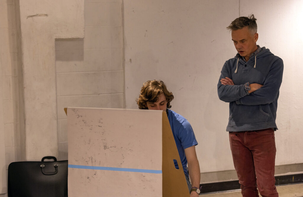 Photo of Tozer, who has taught at UW-Stout for 13 years, observing one of his students working in the Drawing I class. (UW-Stout)