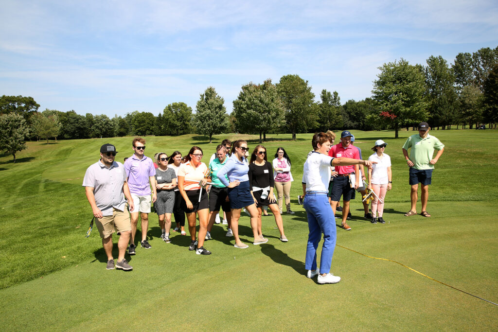 Photo of UW-Stout golf enterprise management students learn about course management issues from Professor Kris Schoonover. / UW-Stout