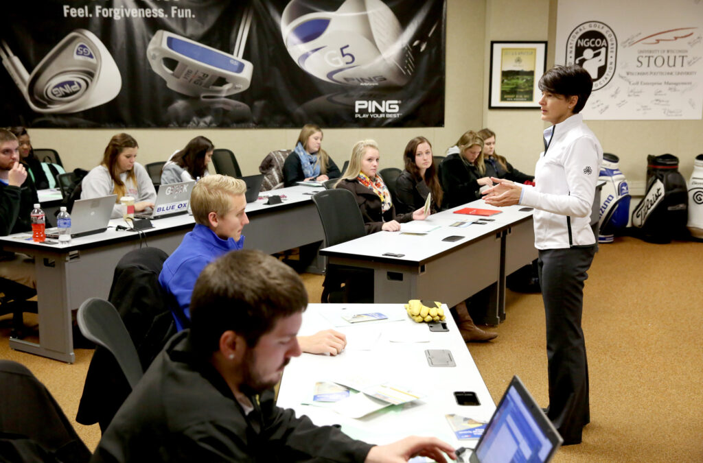 Photo of Professor Kris Schoonover teaches in a golf enterprise management class. / UW-Stout