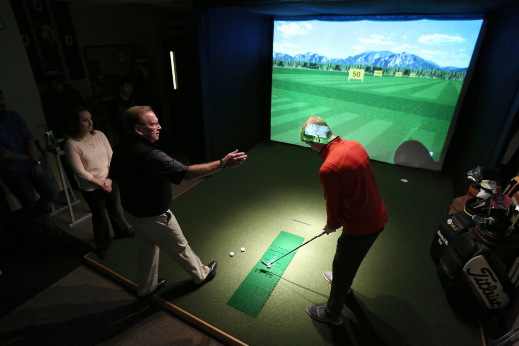 Photo of a golf simulator on campus used for the Fitting and Swing Analysis class in the GEM program. / UW-Stout