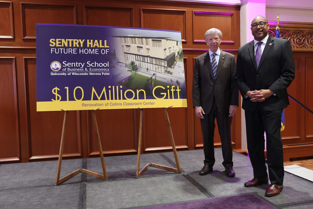 Photo of UW-Stevens Point Chancellor Thomas Gibson (right) and Pete McPartland, chairman of the board, president and CEO of Sentry, announcing a $10 million gift to the School of Business and Economics today (Dec. 15), the largest gift the university has received.