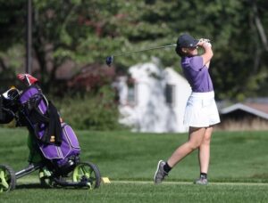 Photo of playing golf: Golf and the data analytics program attracted Grace Nemecek to UW-Stevens Point. The 2021 graduate works for LexisNexis.(Photo courtesy of UWSP Athletics/Kylie Bridenhagen)