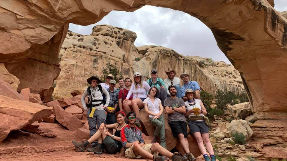 Photo of UW Oshkosh students posing with a geological rock formation. UW Oshkosh’s summer geology field camp is designed to expose students to a wide variety of rock types and geologic settings. Projects are conducted in the Wasatch Mountains, as well as other parts of Utah and Nevada. (Photo courtesy of UW Oshkosh)