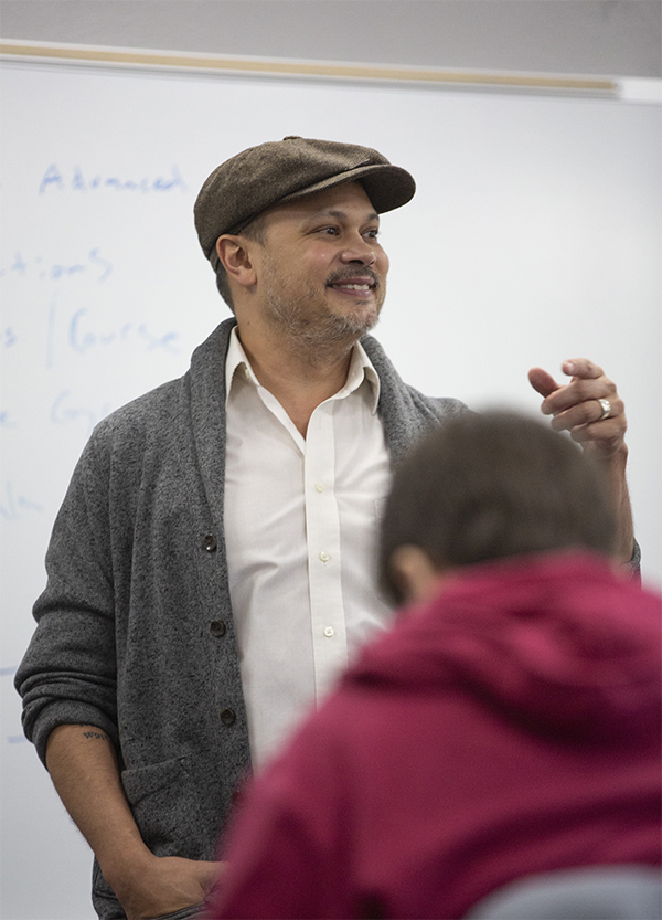 Photo of Nick Gulig, associate professor of Languages and Literatures, who is Wisconsin Poet Laureate. Gulig is shown on the first day of the 2023 spring semester with his advanced writing students, on Monday, Jan. 23, 2023. (UW-Whitewater Photos/Craig Schreiner)