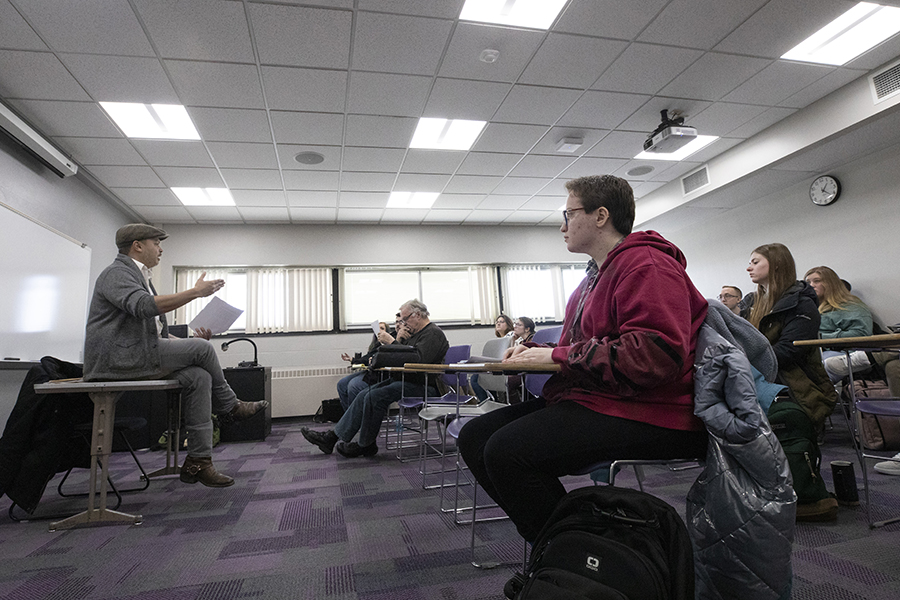 Photo of Wisconsin Poet Laureate Nick Gulig, left, leading a discussion with an advanced writing class on Monday, Jan. 23, 2023. (UW-Whitewater Photos/Craig Schreiner)