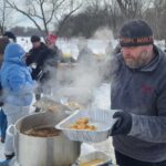 Photo of Senior Executive Chef Robb Hanson, from the university’s food service, preparing a classic Wisconsin fish fry for those in attendance.