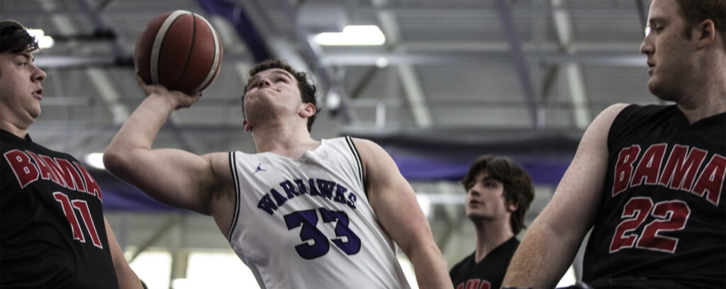 Photo of the Warhawks’ AJ Fitzpatrick shooting in the second half against the University of Alabama. The UW-Whitewater Men’s and Women’s Wheelchair Basketball Teams hosted the first day of a two-day tournament of elite college teams at Kachel Fieldhouse on Friday, Dec. 2, 2022 (UW-Whitewater photo/Craig Schreiner)