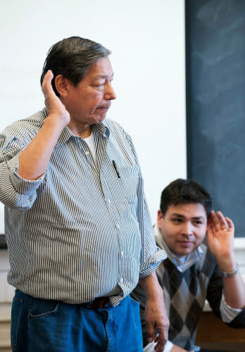 Photo of Mr. Garvin: On Jan. 23, 2009, Cecil Garvin (left) listens to his students’ response while teaching a Ho-Chunk Native American language class in Science Hall. His son, UW–Madison alumnus Henning Garvin (right), was co-teaching the class.