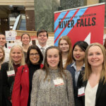 Photo of nine UW-River Falls students who presented their Research in the Rotunda projects at the state Capitol on March 8. Participants and university staff at the event include (back row, left to right) Diego Theisen, Cierra Kirkwood, and Dylan Jensen; (front row, left to right) Sophia Cobian, McKinley Davis, Emma Etten, UWRF Chancellor Maria Gallo, Beth Mcilquham, Sierra Kolodjski, Yihong Deng, Faculty Adviser Grace Lewis, and URSCA Director Molly Gerrish. Beth Schommer/UWRF photo.