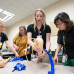 Photo of UWO nursing students holding emergency intervention training for faculty, staff and others at the Fond du Lac campus.