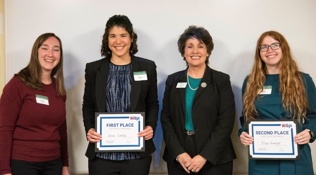 Photo of UW-Parkside Chancellor Dr. Debbie Ford, center-right, and WiSys Regional Intellectual Property and Licensing Associate Allee Marti, left, congratulating UW-Parkside students Elise Zevitz, center-left, and Elisa Kurber, right, for their successful participation in the WiSys Quick Pitch @ UW-Parkside (Photo courtesy of Laura Mason, UW-Parkside).