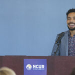 Photo of Dr. Tayo Sanders, a UW-Eau Claire graduate who was selected for the prestigious Rhodes Scholarship program, returning to his alma mater this spring to talk about how his faculty mentors and undergraduate research experiences continue to shape his life and career. (Photos by Bill Hoepner/UW-Eau Claire)