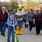 Photo of participants in the Walk with an Eagle program at UW-La Crosse, which matches recreational therapy students with older adults, with the goal of sparking social connections through the simple act of walking and talking. Part of UWL's Community Engaged Learning program, the course is taught by Assistant Professor Jennifer Taylor.