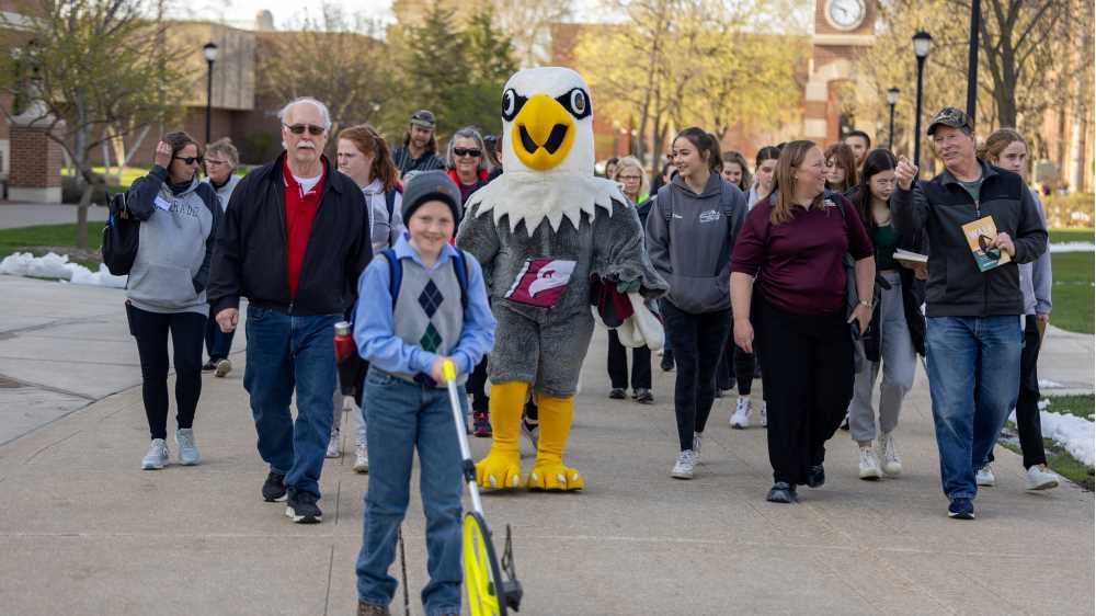 Photo of participants in the Walk with an Eagle program at UW-La Crosse, which matches recreational therapy students with older adults, with the goal of sparking social connections through the simple act of walking and talking. Part of UWL's Community Engaged Learning program, the course is taught by Assistant Professor Jennifer Taylor.