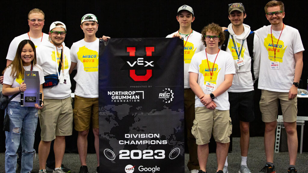 Photo of WiscoBots team members, pictured left to right: Agii Kerwin, Austin Attig, Max Van Rossum, John Bertello, Scott McDermott, Jimmy McGovern, Henry Hathaway and Nathan Sandvig. Photos courtesy of VEX and WiscoBots.