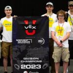 Photo of WiscoBots team members, pictured left to right: Agii Kerwin, Austin Attig, Max Van Rossum, John Bertello, Scott McDermott, Jimmy McGovern, Henry Hathaway and Nathan Sandvig. Photos courtesy of VEX and WiscoBots.