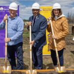 Photo of turf project groundbreaking: alumni Breck (left) and Sheri Loos provided a significant gift to support developing a multipurpose sports complex at UW-Stevens Point. They are with Chancellor Thomas Gibson as work begins on the north side of campus.