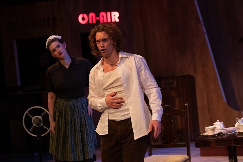 Photo of Chandler Benn singing lead in The Old Maid and the Thief, an American opera performed at UW-Stevens Point this spring. The vocal performance major graduated in May, as did soprano Natalie Romanick.