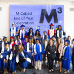 Photo of some of this year's graduates of the M-cubed College Connections program who gathered for a photo after the ceremony in June. (UWM Photo/Elora Hennessey)