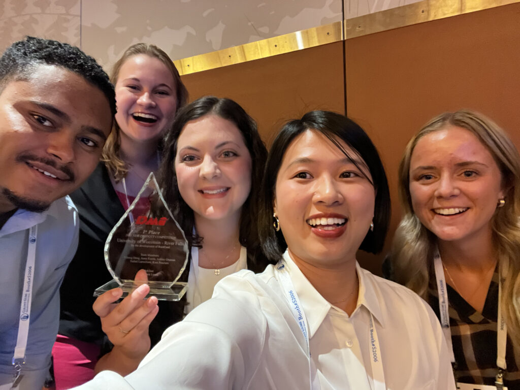 Photo of UW-River Falls students, from left, Rafael Larosiliere, Anna Euerle, Kate Petersen, Yihong Deng, and Ashley Gruman, who won first place in a national contest by developing a dairy-based product aimed at helping ease people’s anxiety. The group won the Dairy Management Inc. New Product Competition and received the award in Chicago. Contributed photo.