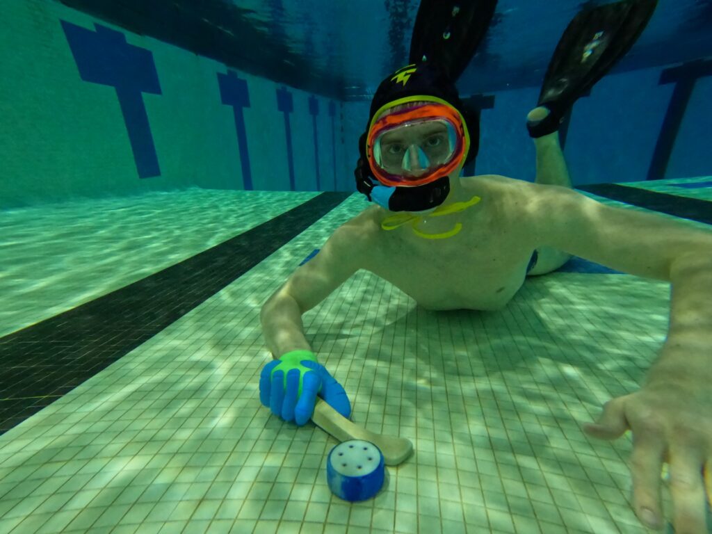 Photo of Bousley playing underwater hockey. He first heard about underwater hockey six years ago. (Photo courtesy of Bousley)