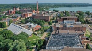 Photo of an aerial view of south campus academic buildings, displaying the Jarvis Hall Tech Wing solar panel array, lower right / UW-Stout