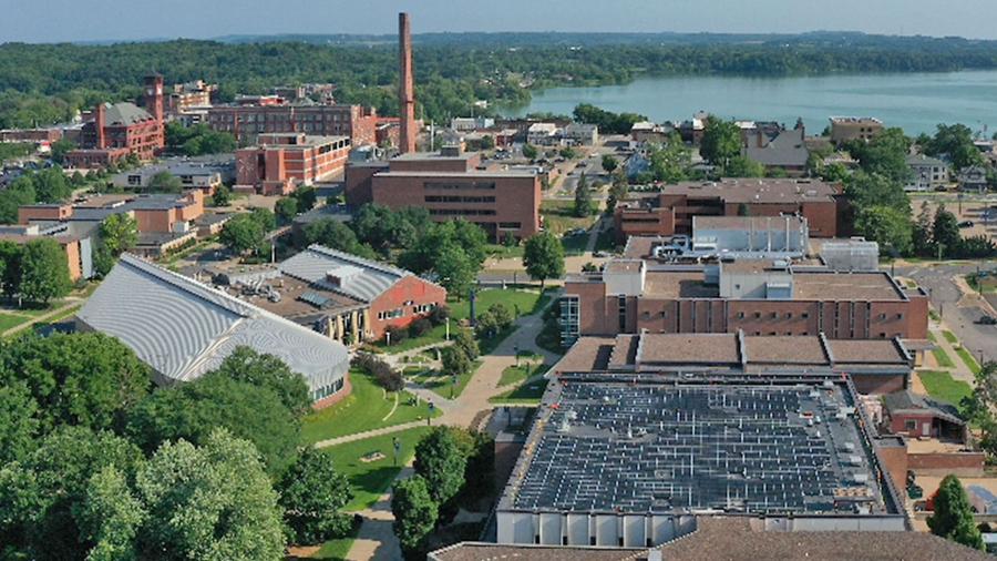 Photo of an aerial view of south campus academic buildings, displaying the Jarvis Hall Tech Wing solar panel array, lower right / UW-Stout
