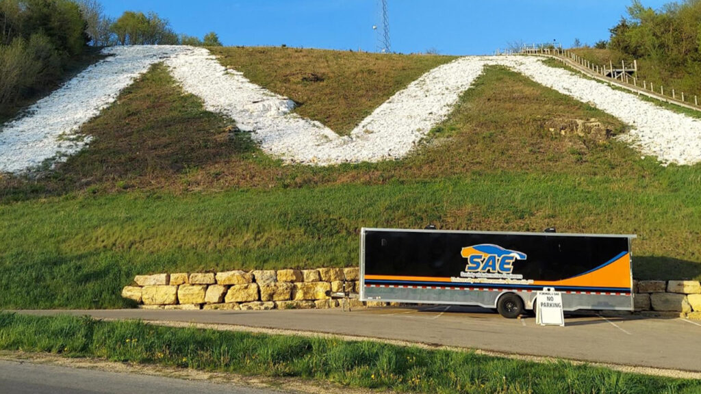 Photo of Members of the UW-Platteville chapter of the Society of Automotive Engineers volunteer their time maintaining the "M."