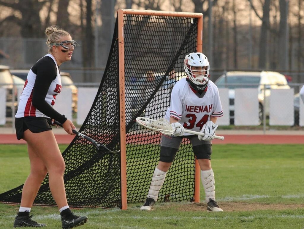 Photo of Allison Schmidli, a first-year student at UW-Stevens Point, who is looking forward to playing collegiate lacrosse after serving as a goalie for the Neenah High School team for the last three years.