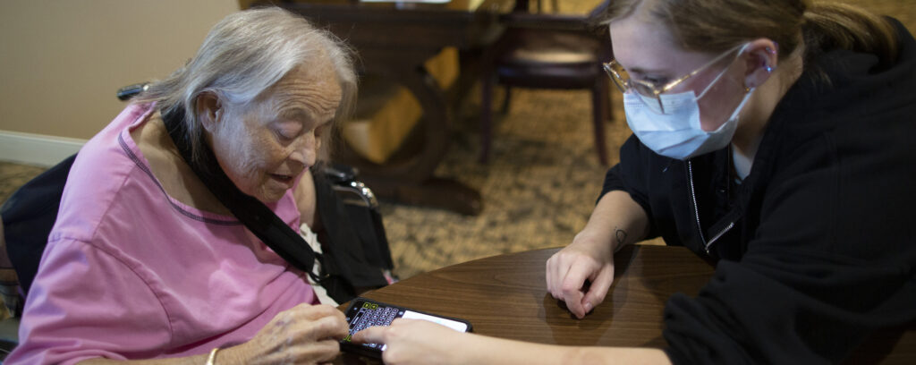 Photo of UW-Whitewater students helping senior citizens use technology