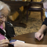 Photo of UW-Whitewater students helping senior citizens use technology