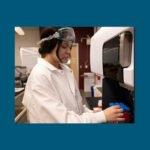 Photo of UWL Senior Katie Peterson preparing samples. To simulate entering the stomach, samples of rubber play surface, wood chips and sand are added to acidic solutions, shaken up and heated at body temperature for two hours, the amount of time the sample would be in someone’s stomach. To simulate a being put in the mouth, a clean water solution is used instead of the acid solution.